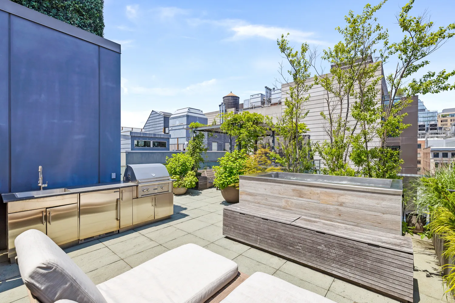 a view of a patio with couches and potted plants
