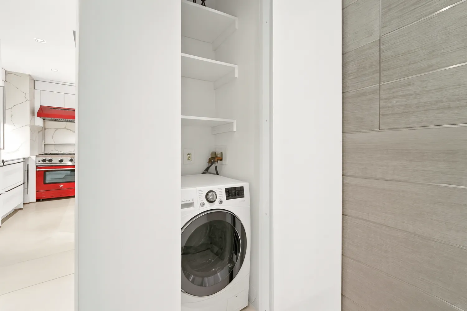 a utility room with washing machine
