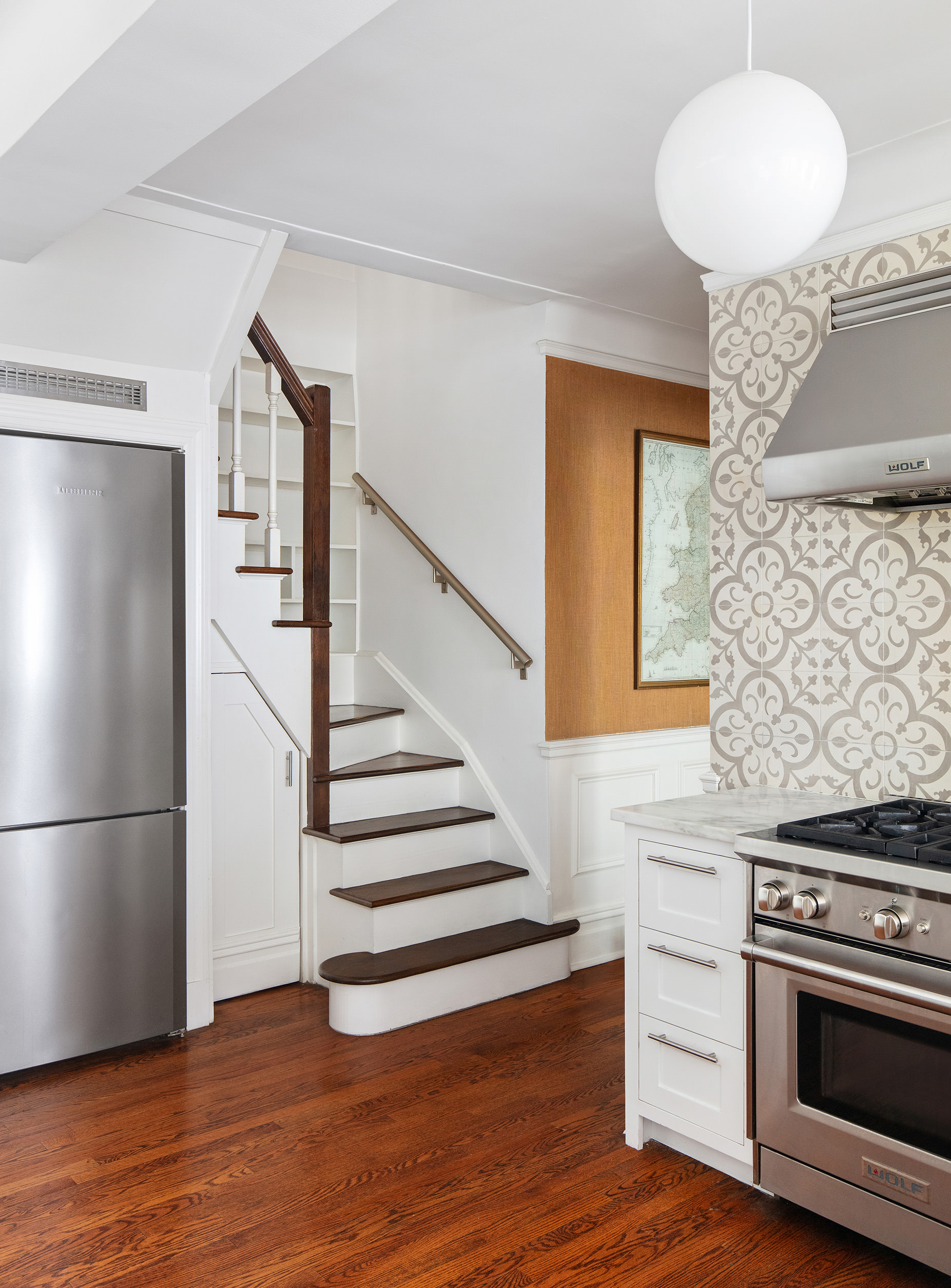 136 East 36th Street, Unit 9/10C Manhattan, NY 10016 - Photo 8 of 16 a kitchen with a refrigerator and a stove