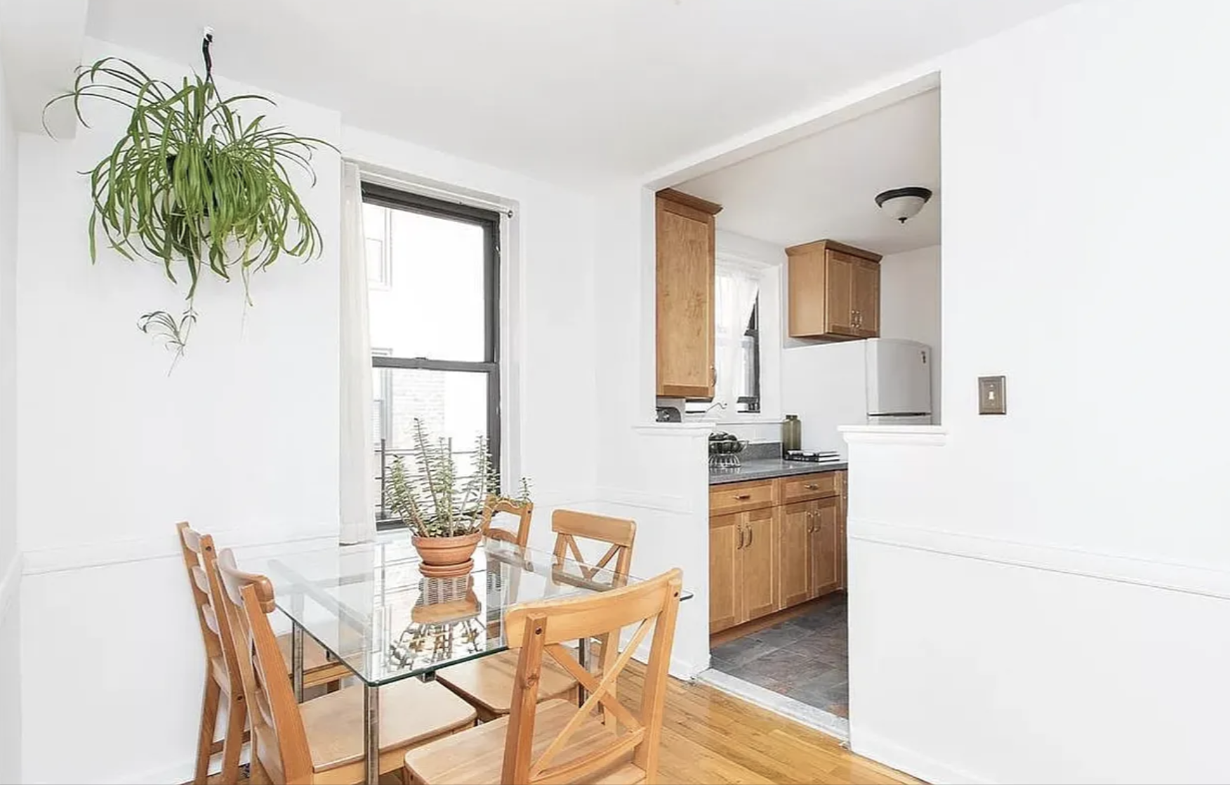 488 Ocean Parkway, Unit 3G Brooklyn, NY 11218 - Photo 3 of 8 a dining room with furniture and a potted plant