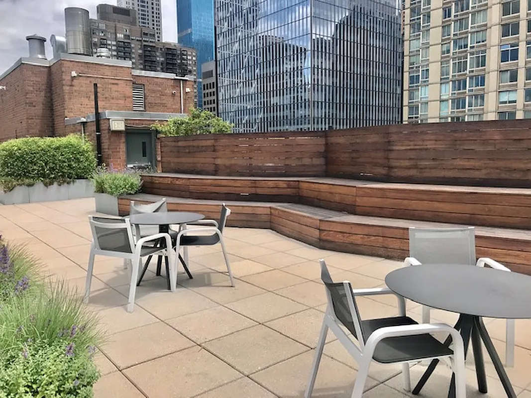 301 West 53rd Street, Unit 3I Manhattan, NY 10019 - Photo 10 of 14 a view of a chairs and a tables in the patio