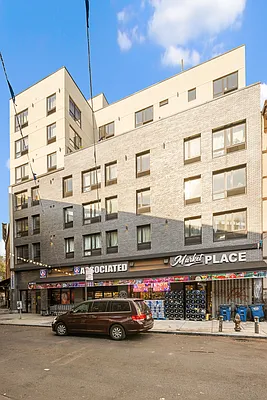 605 Hart Street, Unit 406 Brooklyn, NY 11221 - Photo 8 of 10 a front view of a building with street