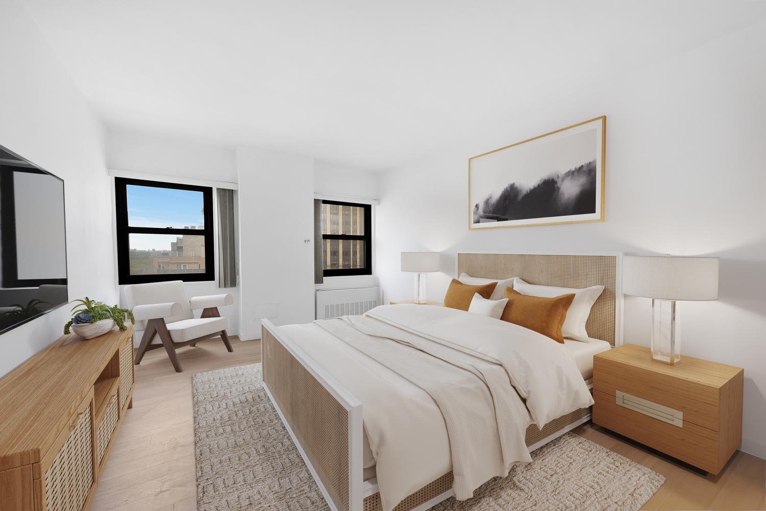 58 West 58th Street, Unit 21C Manhattan, NY 10019 - Photo 7 of 12 a bedroom with a bed and a couch