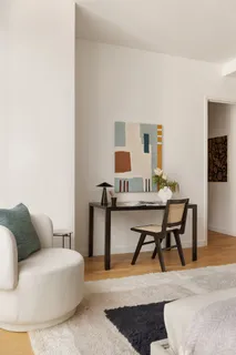 a living room with furniture and a table