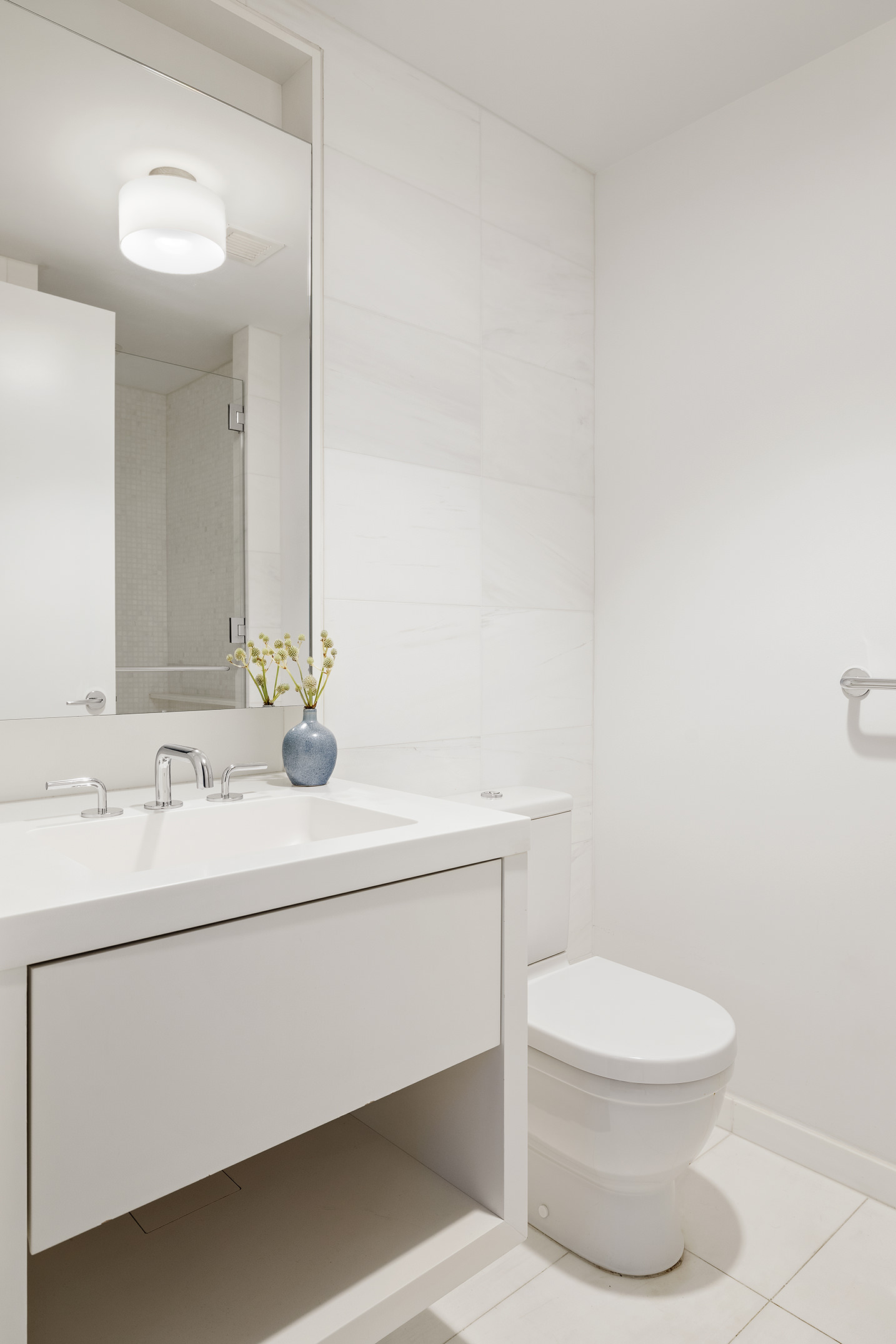 221 West 77th Street, Unit 4E Manhattan, NY 10024 - Photo 7 of 20 a bathroom with a toilet a sink and mirror