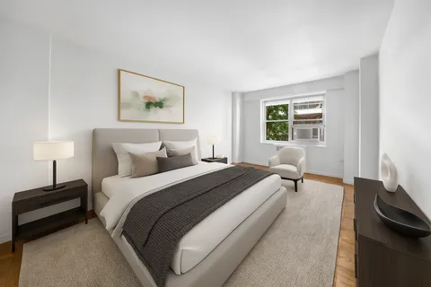 a bedroom with bed and a window