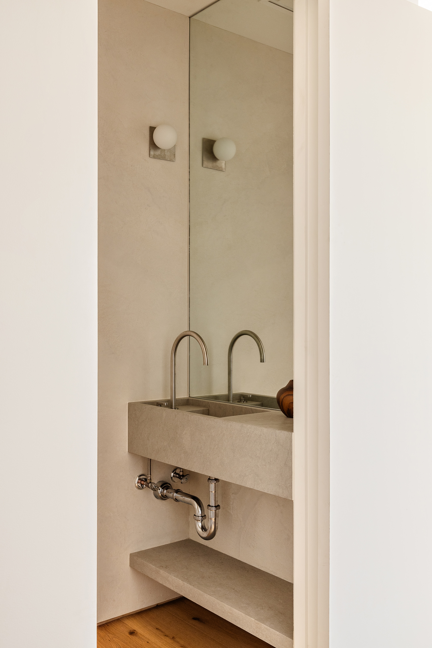 477 Broome Street Manhattan, NY 10013 - Photo 15 of 18 a close view of a sink a mirror and shower in a bathroom