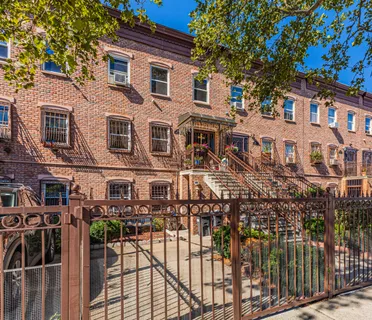 a front view of a building with glass windows