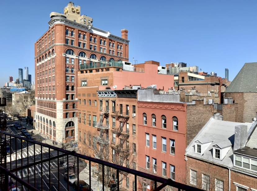 165 Christopher Street, Unit 6J Manhattan, NY 10014 - Photo 8 of 16 a view of a building from a balcony