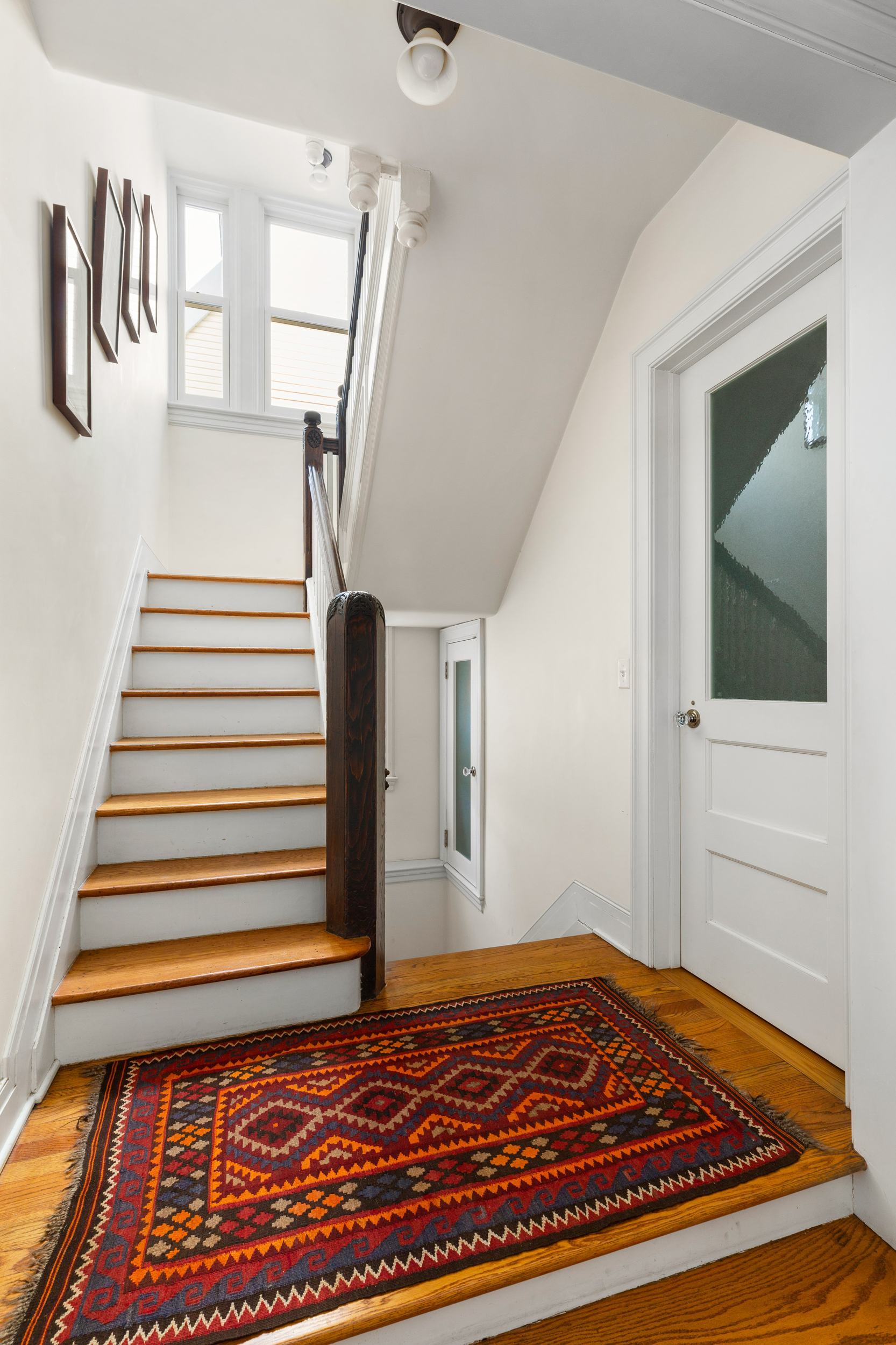 200 Fenimore Street Brooklyn, NY 11225 - Photo 11 of 24 a view of a hallway with wooden floor and stairs