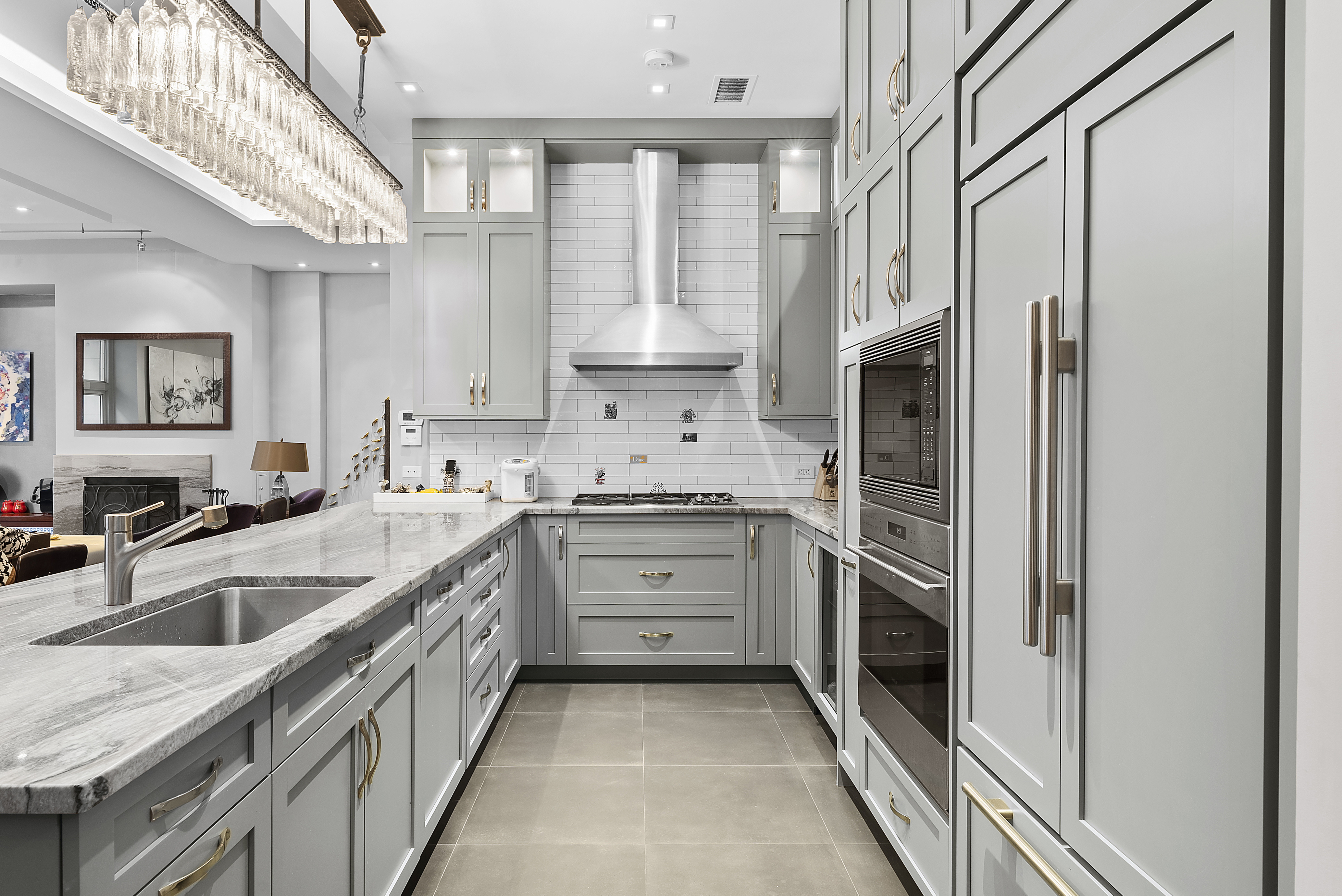 66 Leonard Street, Unit 2A Manhattan, NY 10013 - Photo 2 of 15 a kitchen with stainless steel appliances granite countertop a refrigerator and a sink