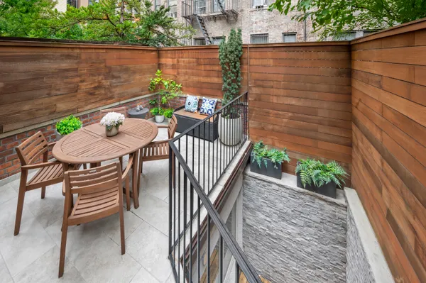 a view of a balcony with chairs