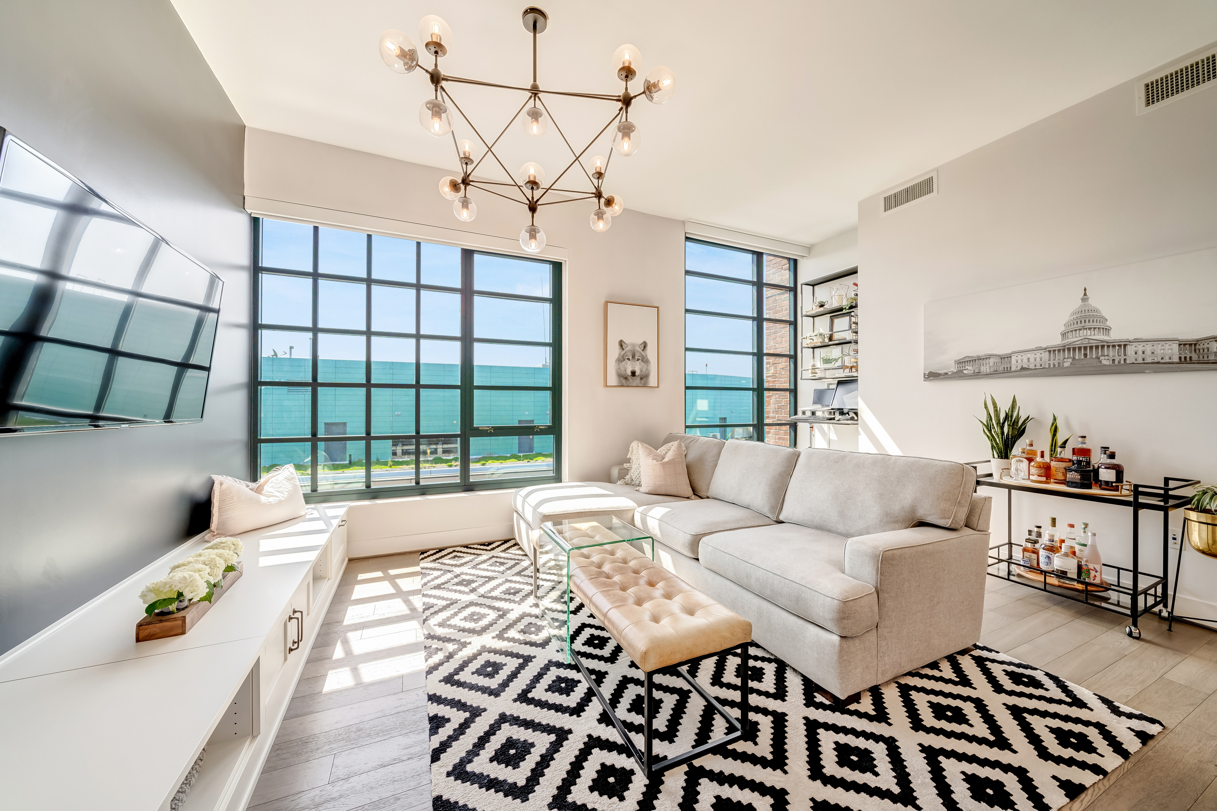 45 Sutton Square Southwest, Unit PH10 Washington, DC 20024 - Photo 7 of 44 a living room with furniture and a window