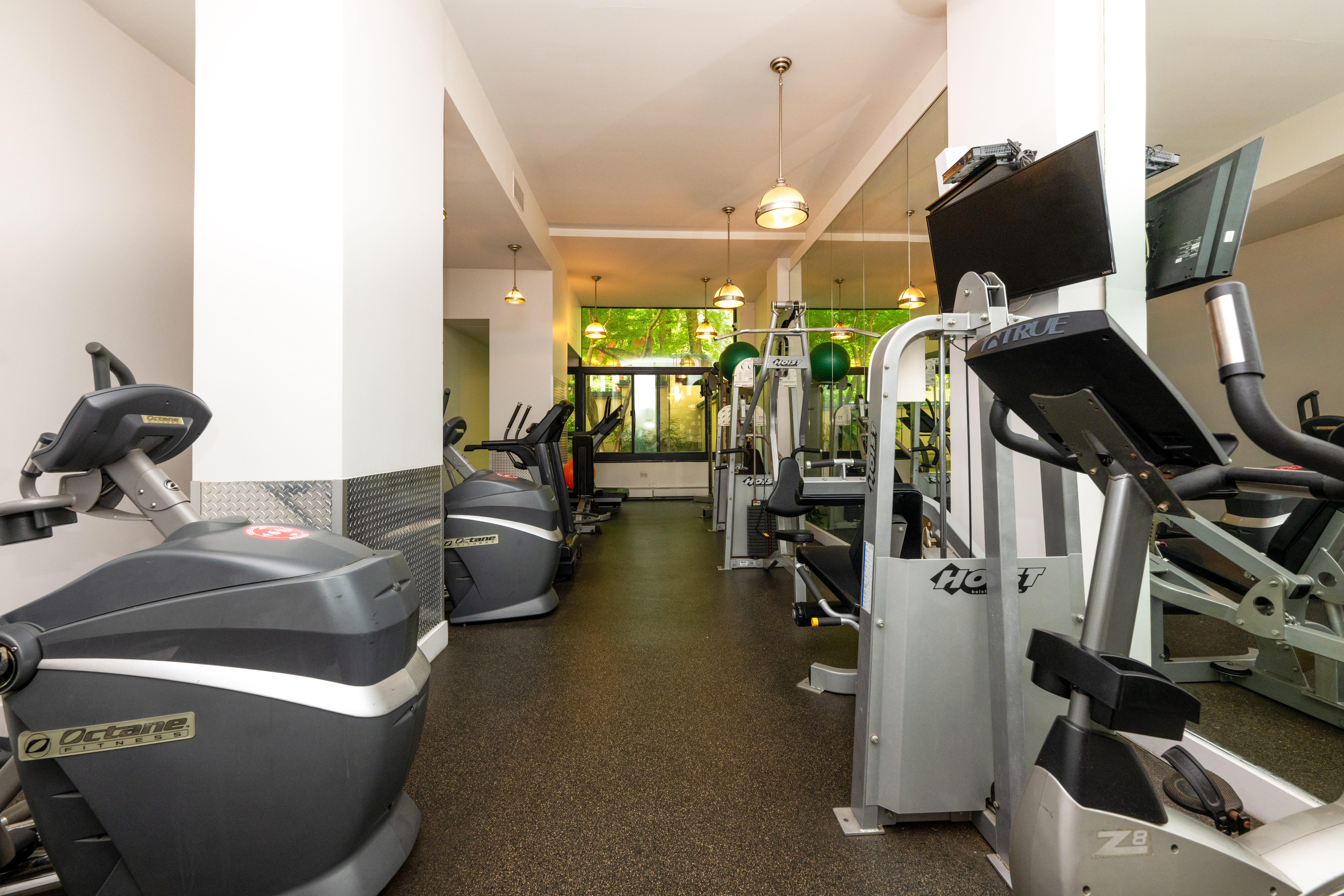 124 East 79th Street, Unit 7D Manhattan, NY 10075 - Photo 21 of 26 a living room with furniture and a flat screen tv