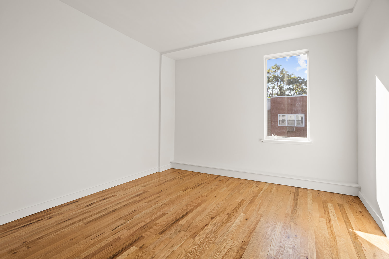 65 Jackson Street, Unit 2 Brooklyn, NY 11211 - Photo 4 of 7 an empty room with a window
