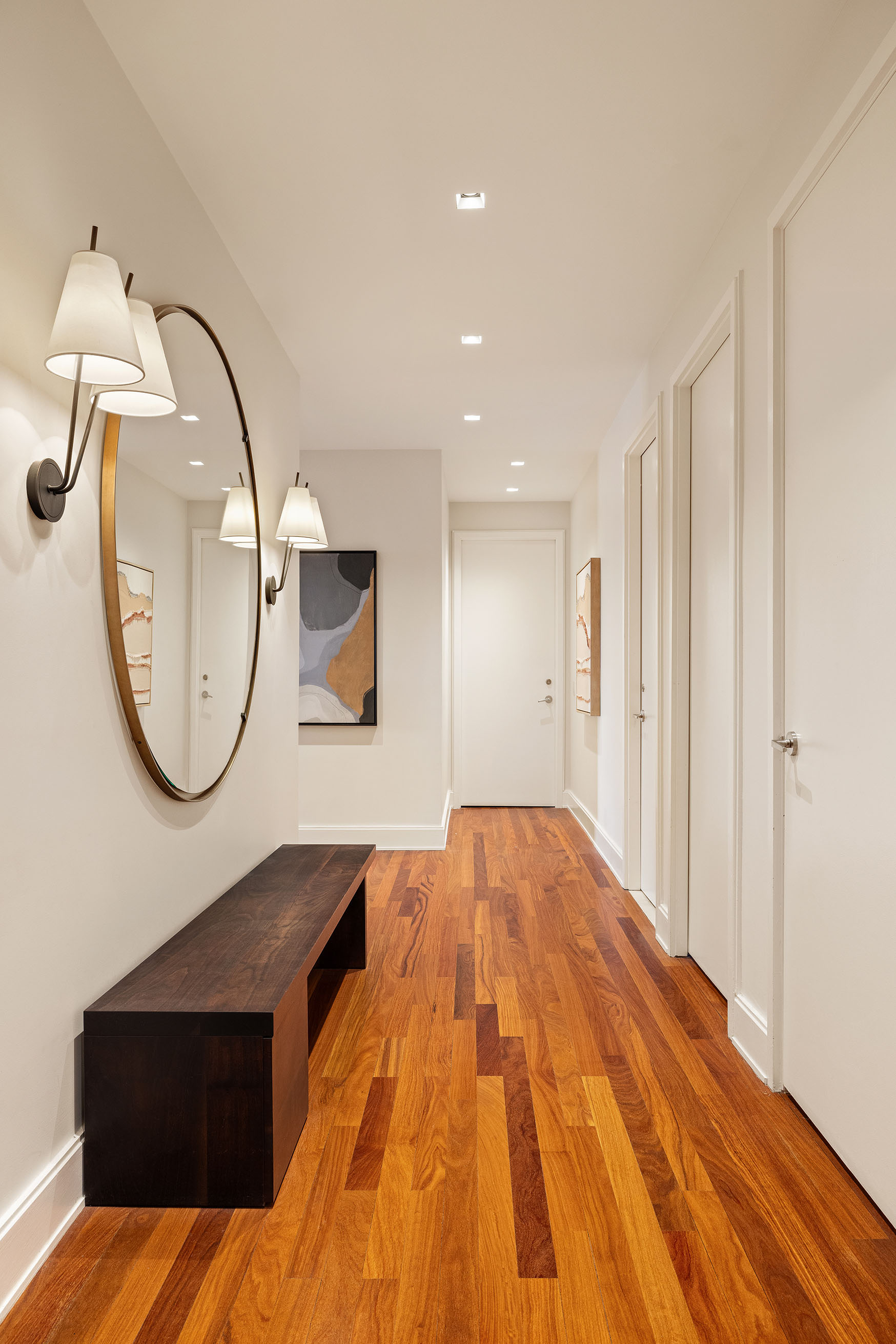 92 Laight Street, Unit 6D Manhattan, NY 10013 - Photo 14 of 15 a view of a livingroom with wooden floor and a staircase