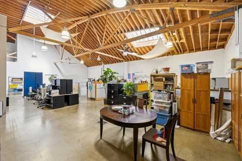 a view of a livingroom with furniture and a chandelier