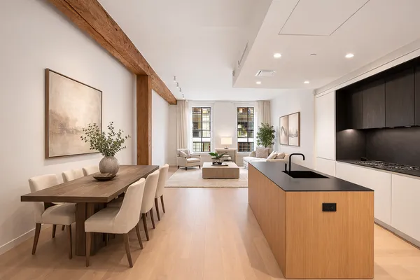 a kitchen with granite countertop lots of counter top space and living room