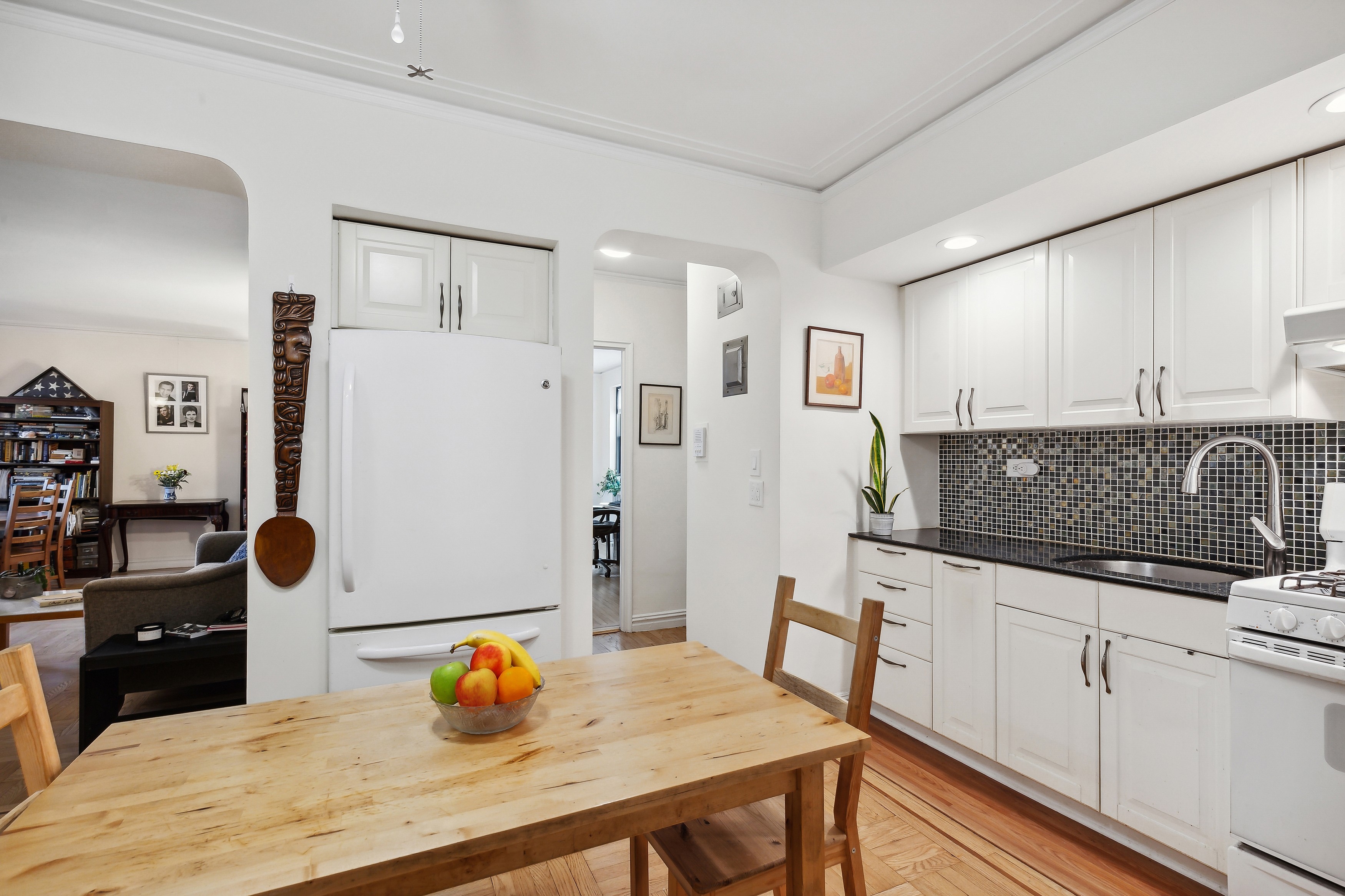 50 Park Terrace East, Unit 7E Manhattan, NY 10034 - Photo 5 of 19 a kitchen with stainless steel appliances a stove a refrigerator a sink a counter space and cabinets