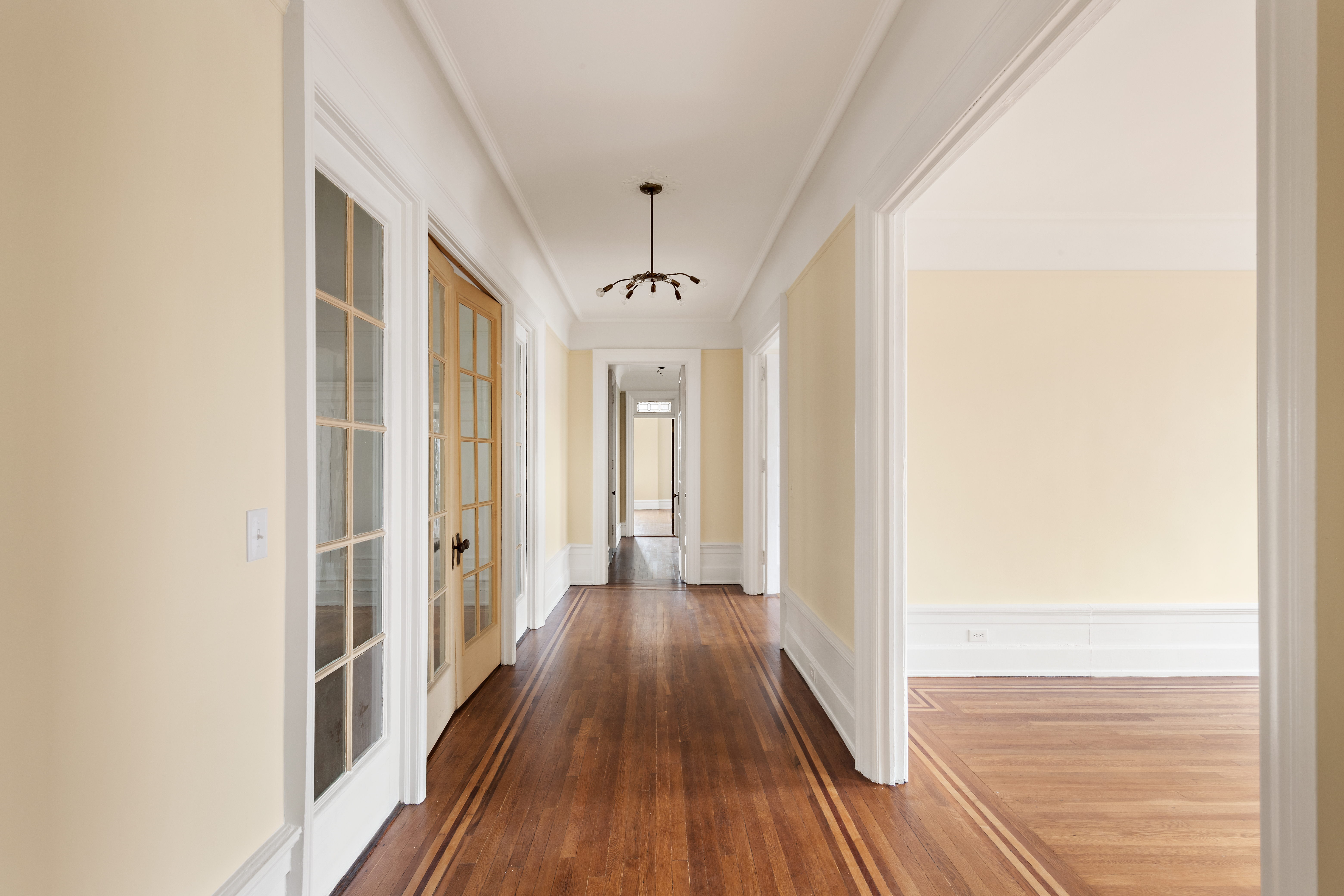 800 Riverside Drive, Unit 6E Manhattan, NY 10032 - Photo 16 of 30 a view of a hallway with wooden floor