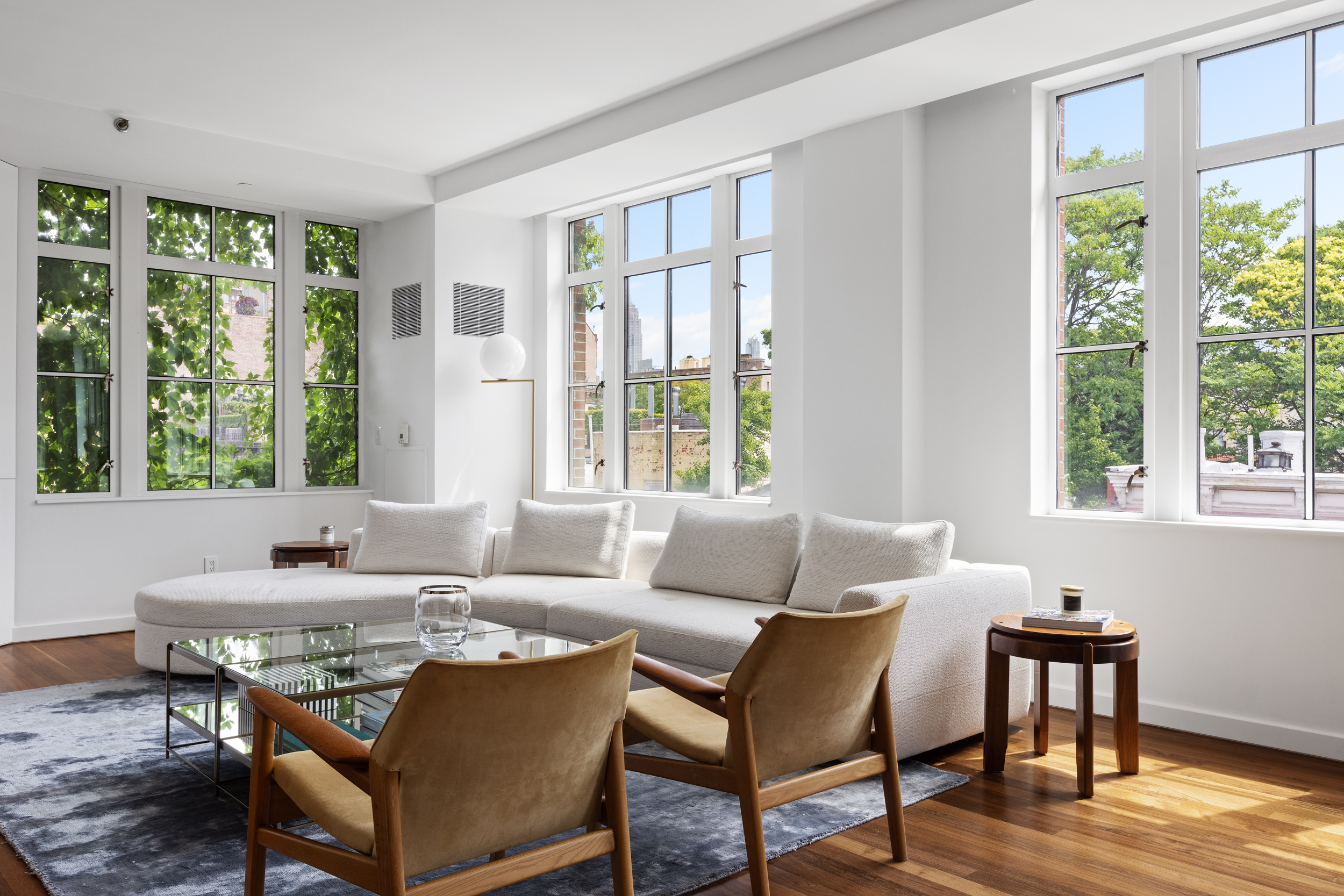 744 Greenwich Street, Unit 4 Manhattan, NY 10014 - Photo 20 of 34 a living room with furniture and a large window