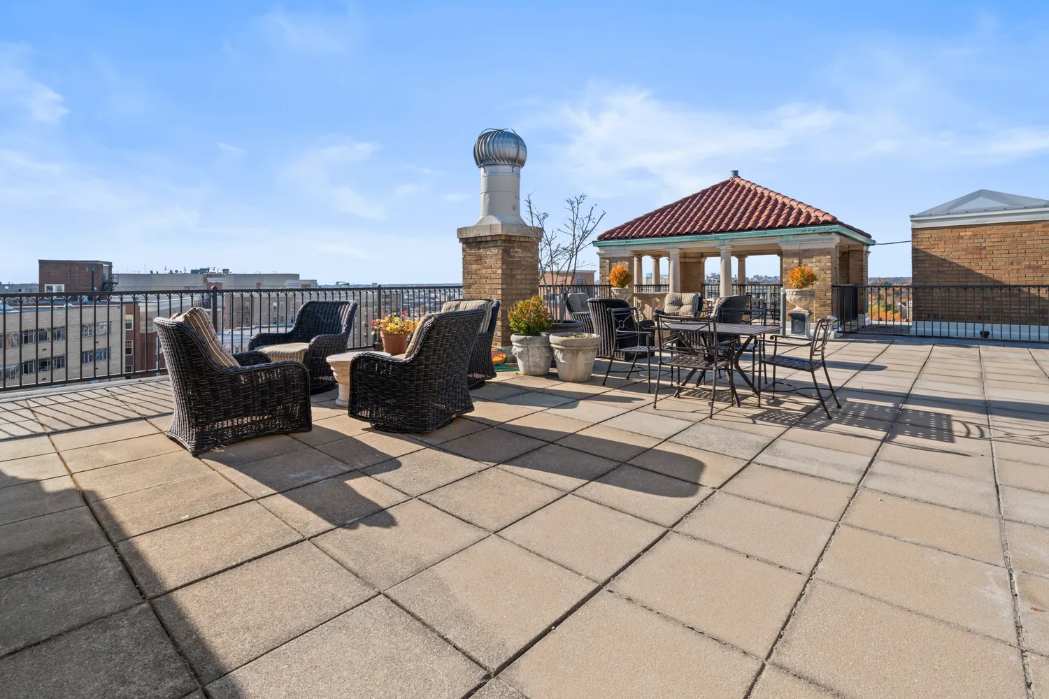 a front view of a house with sitting area