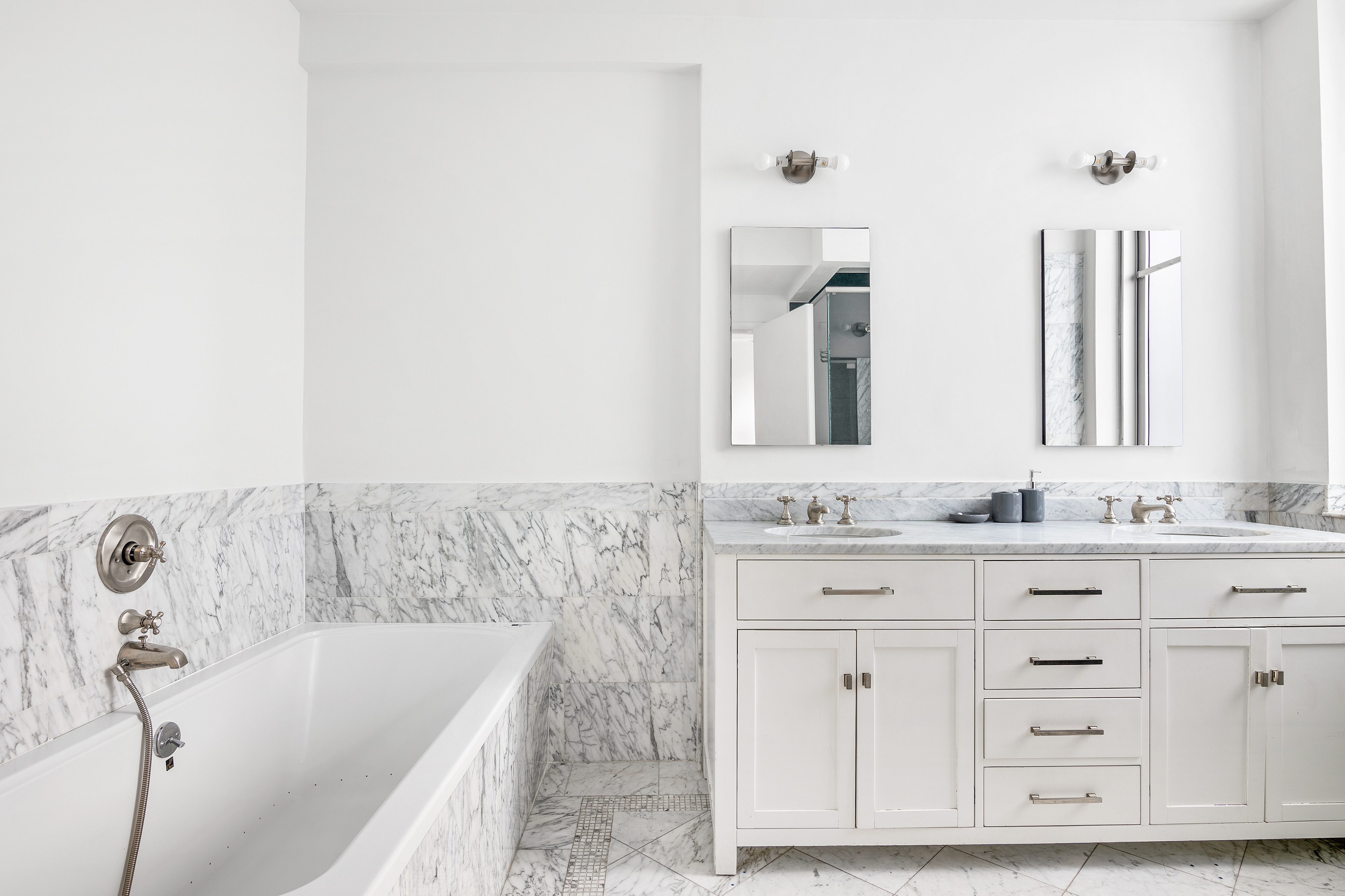 122 East 25th Street, Unit 6 Manhattan, NY 10010 - Photo 10 of 17 a bathroom with a bathtub and a sink