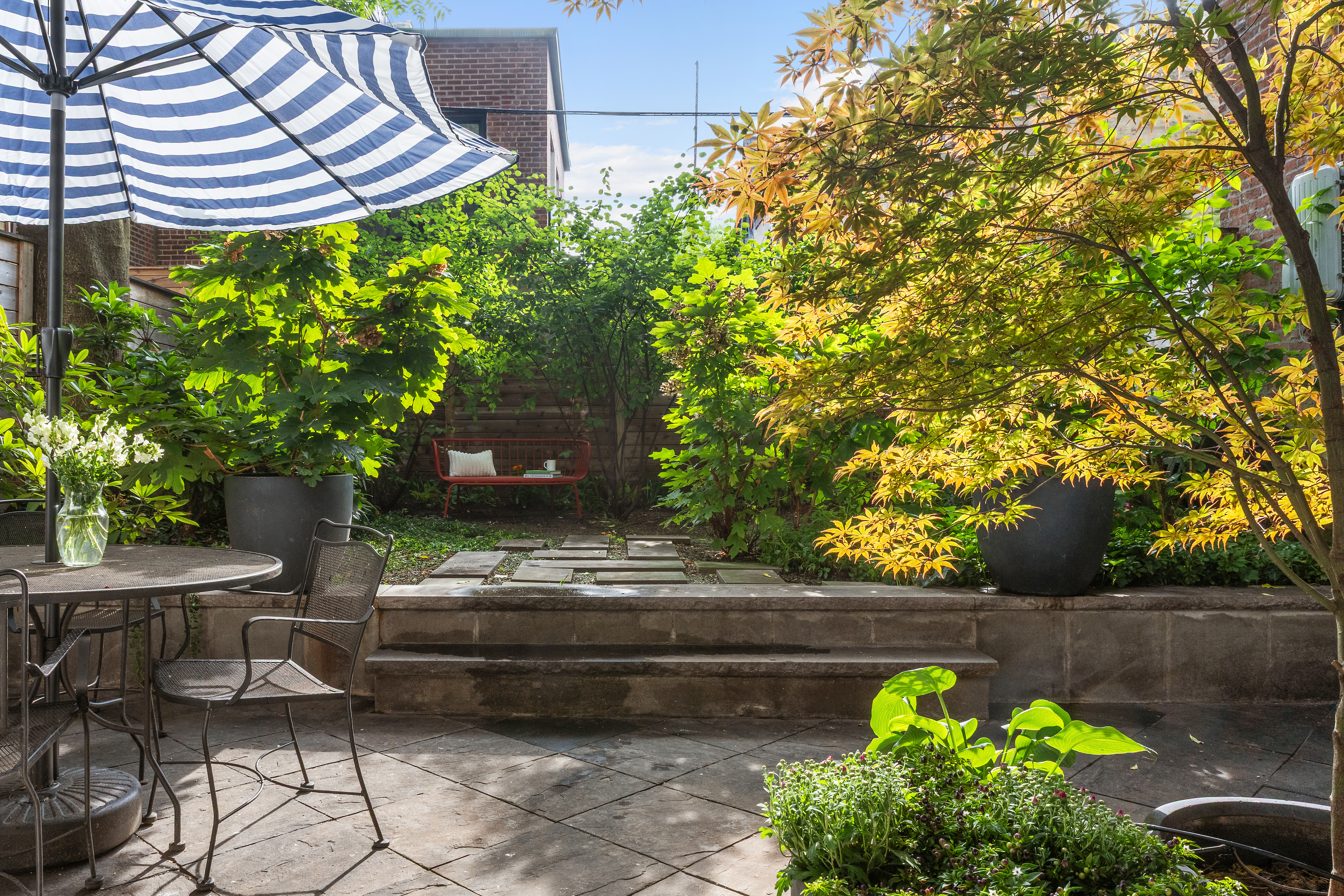 417 Clinton Street, Unit 1 Brooklyn, NY 11231 - Photo 6 of 18 a view of a backyard with chairs and a plants