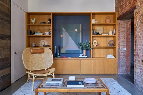 a room with furniture and a book shelf