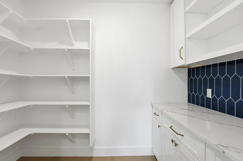 a kitchen view with cabinets