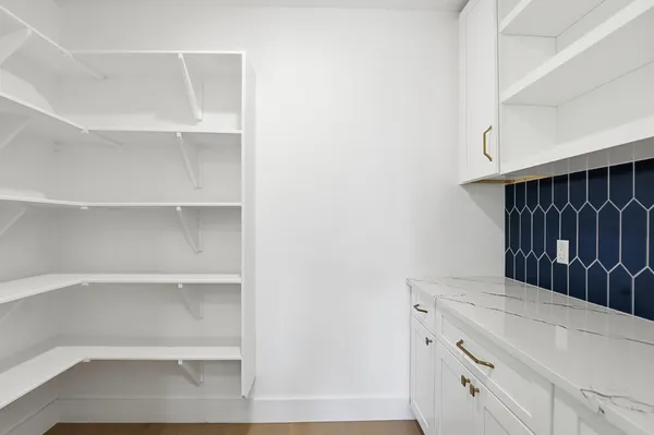a kitchen view with cabinets