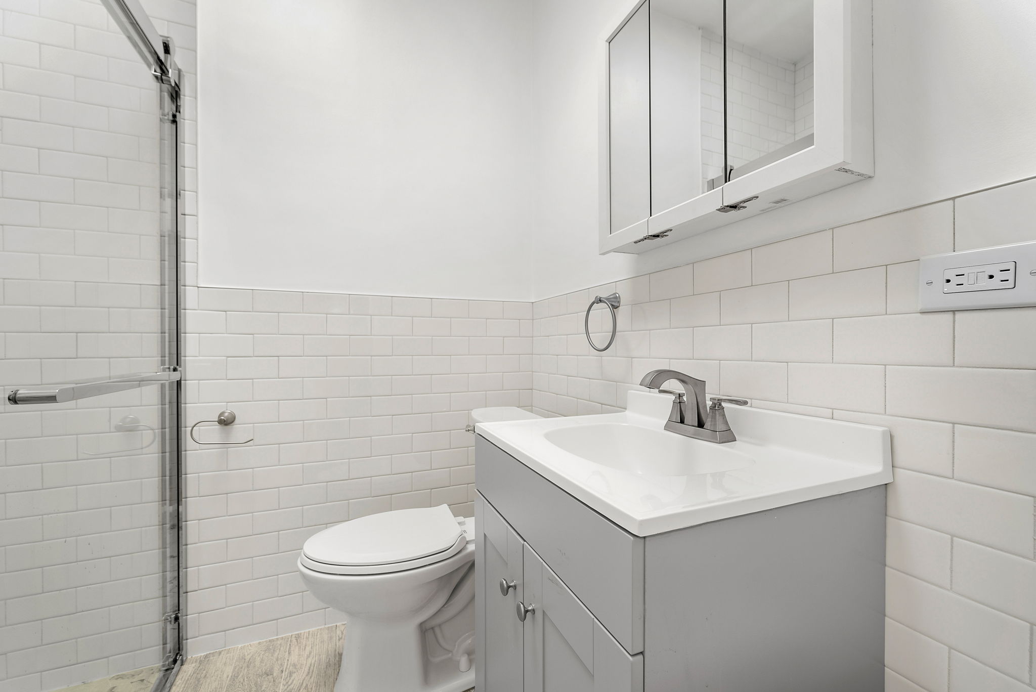 710 Carroll Street Brooklyn, NY 11215 - Photo 7 of 10 a bathroom with a sink a toilet and mirror