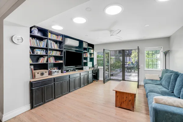 a large kitchen with kitchen island a large counter space a sink and a couch