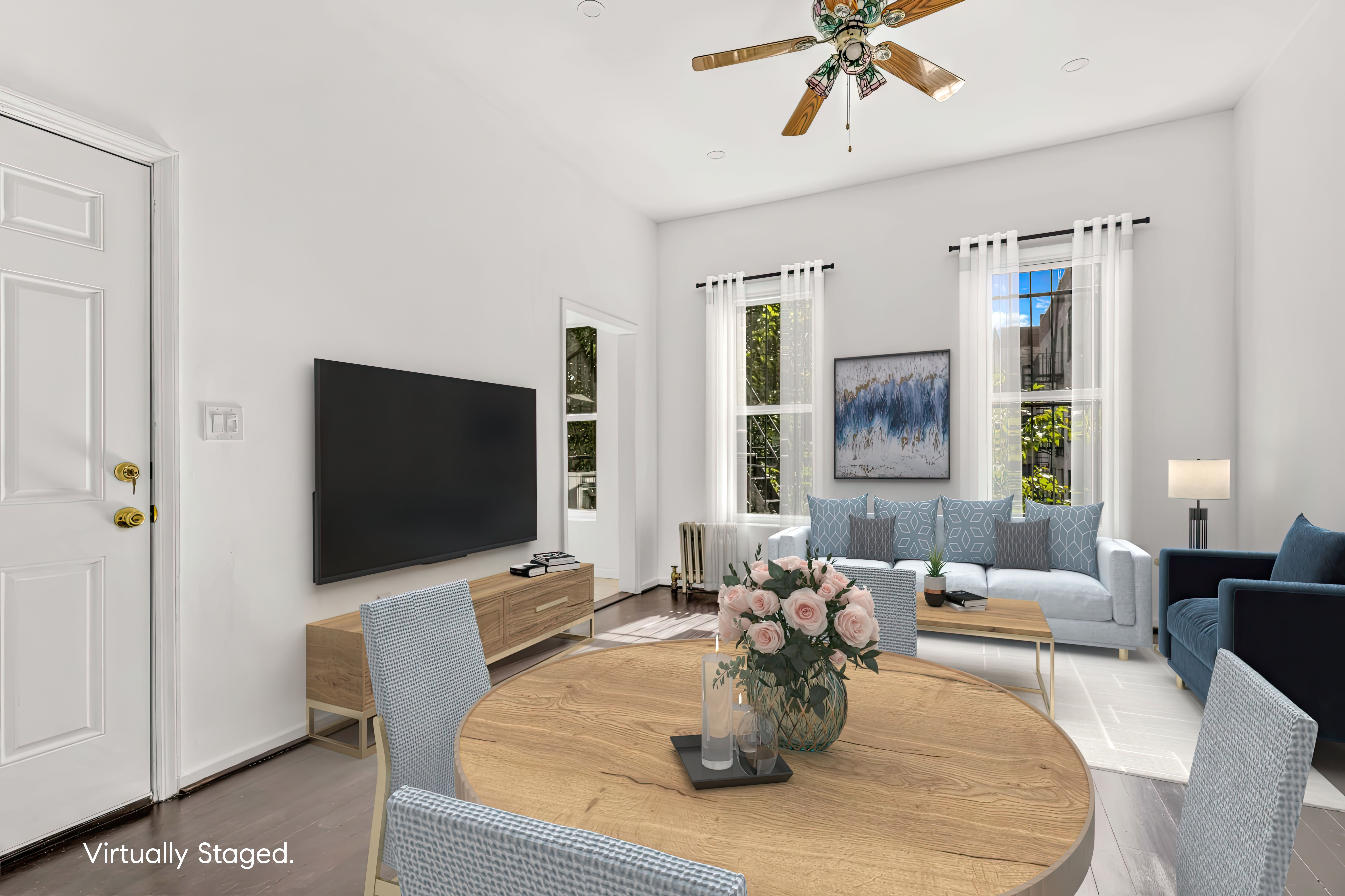 238 Vernon Avenue, Unit 2 Brooklyn, NY 11206 - Photo 7 of 21 a dining room with couches a coffee table and a flat screen tv