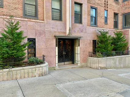 a view of a livingroom with furniture and a window