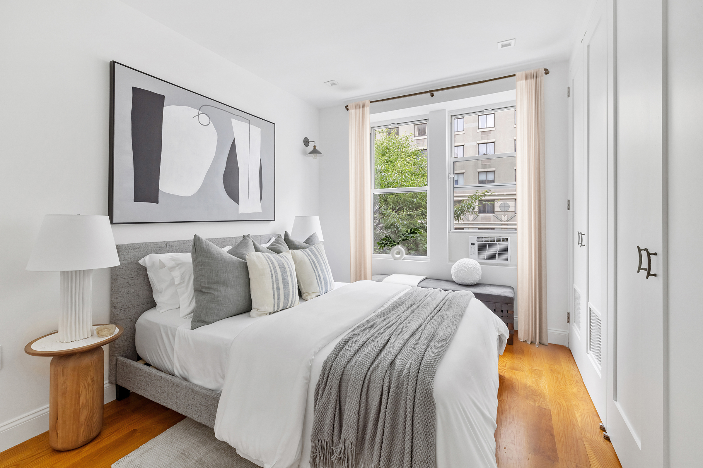 328 West 96th Street, Unit 2C Manhattan, NY 10025 - Photo 8 of 15 a bedroom with a bed and a window