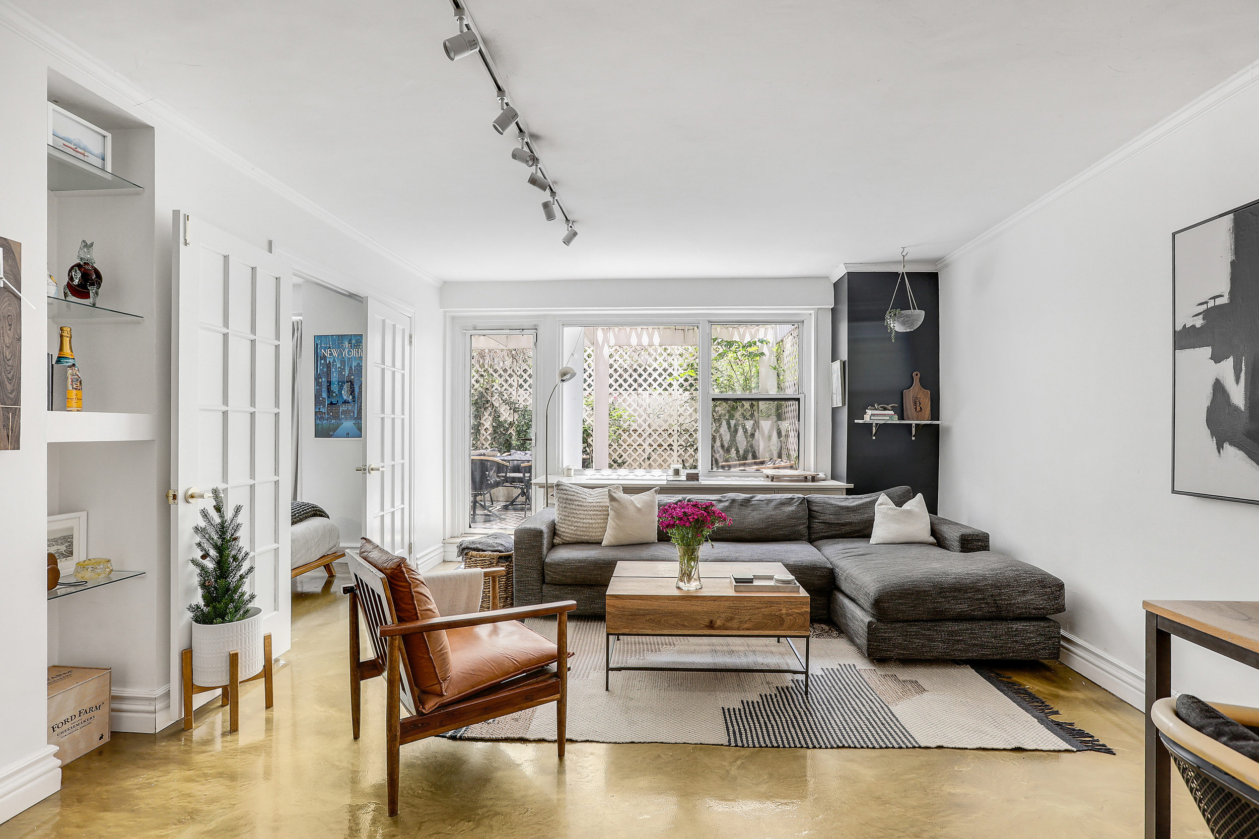 a living room with furniture and a large window