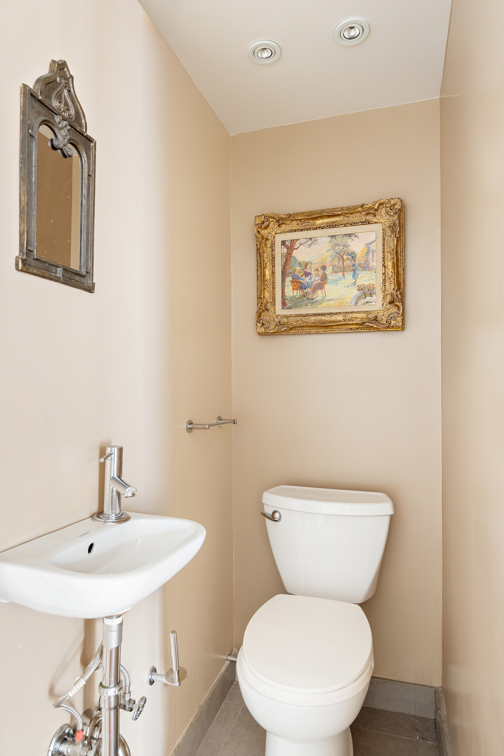 860 5th Avenue, Unit 11E Manhattan, NY 10065 - Photo 8 of 9 a white toilet sitting next to a bathroom sink