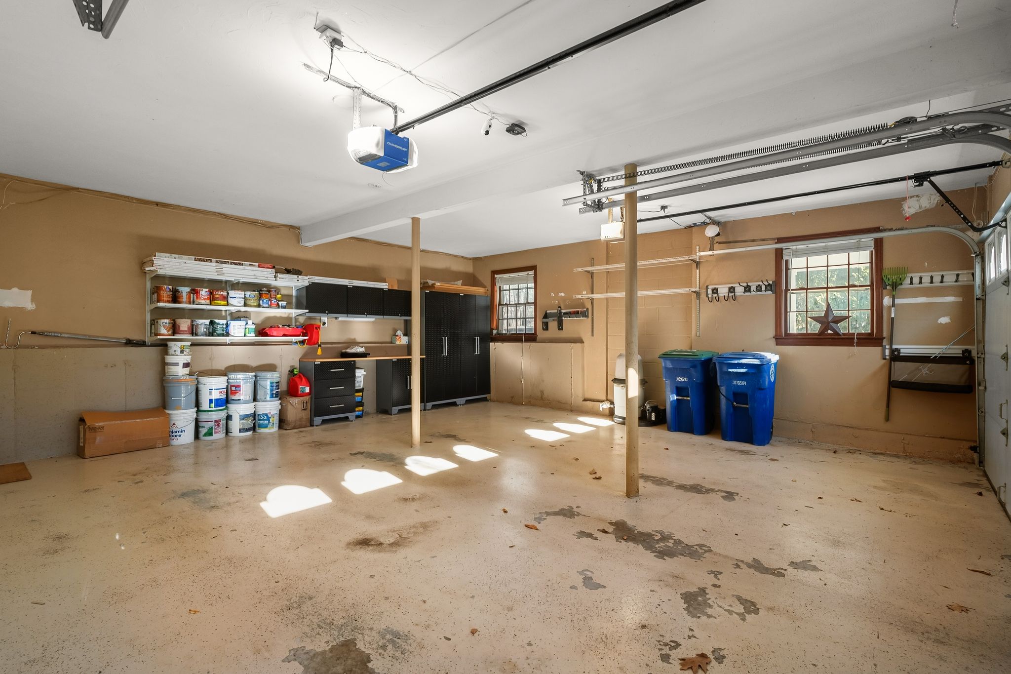 129 H J Albee Drive Braintree, MA 02184 - Photo 26 of 36 a garage with furniture and a ceiling fan
