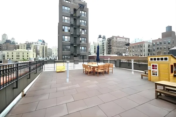 a view of roof deck with seating space and barbeque oven
