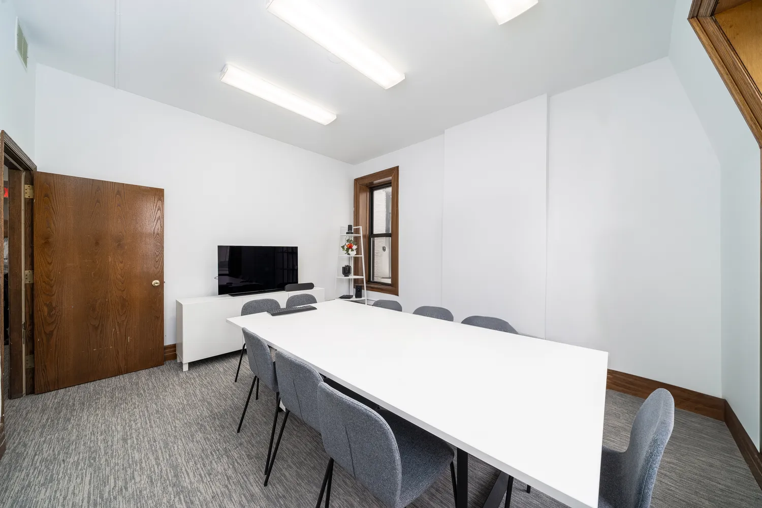 a workspace with furniture and wooden floor