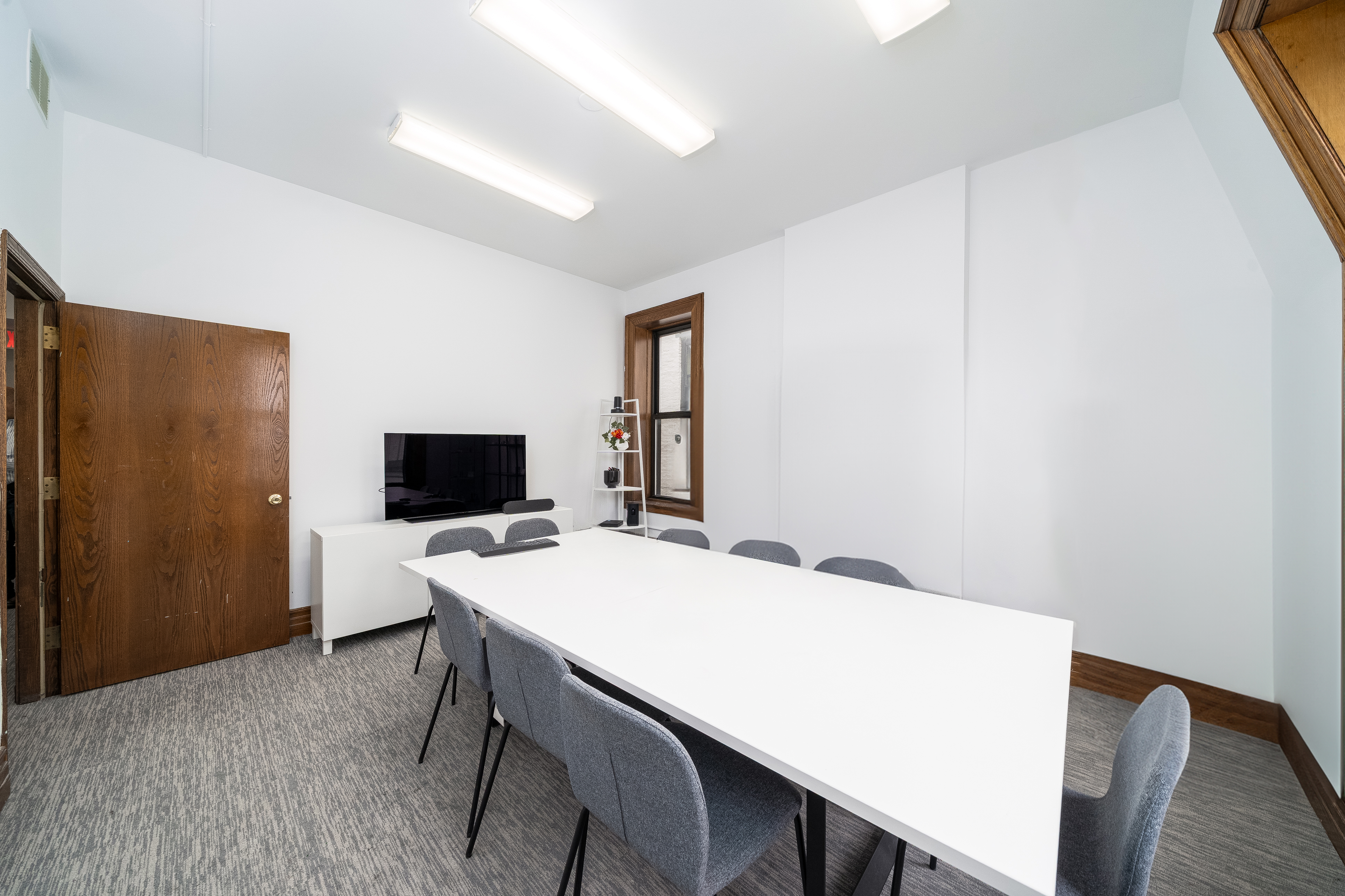 84 Washington Street Hoboken, NJ 07030 - Photo 7 of 9 a workspace with furniture and wooden floor