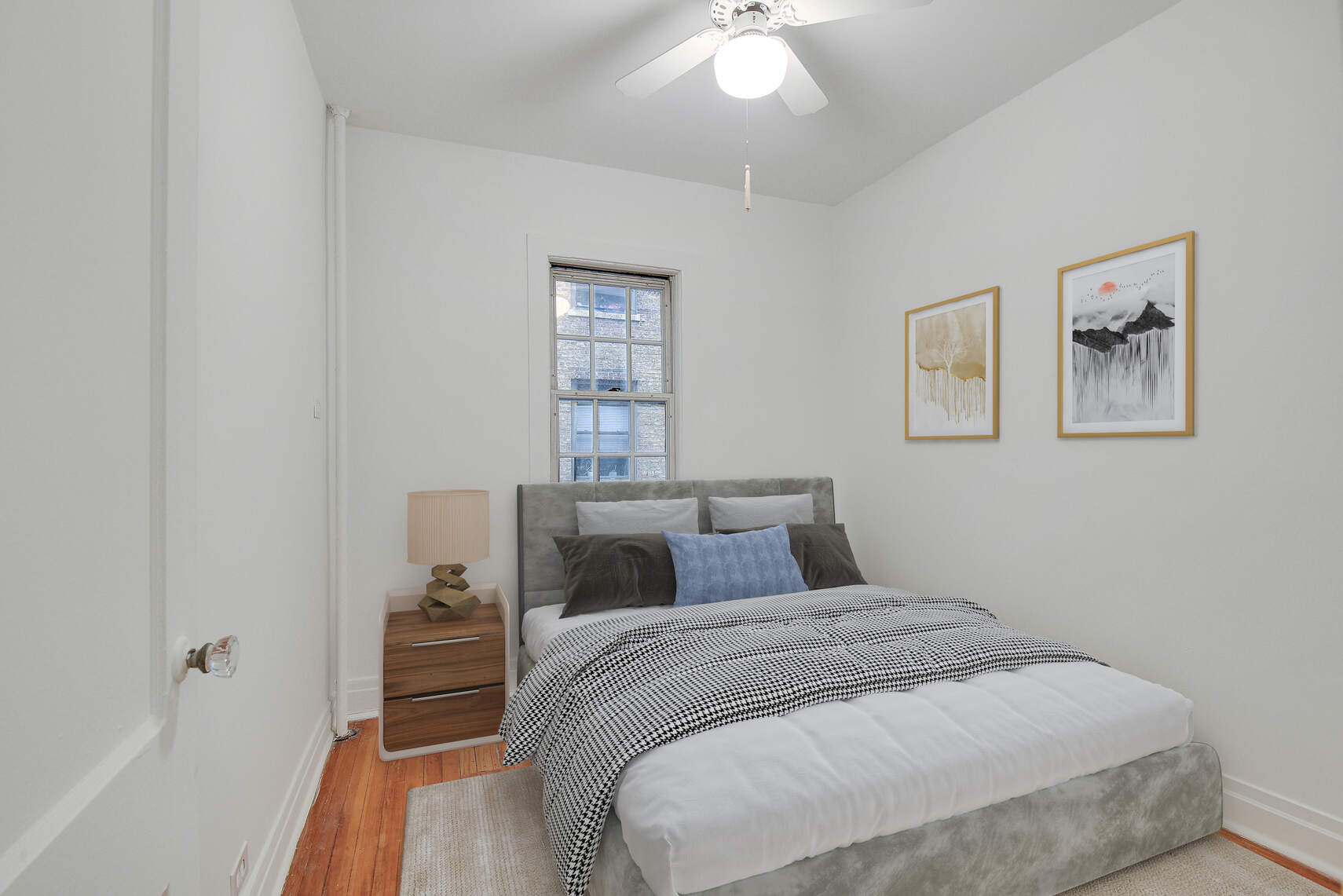 19 Pomander Walk, Unit 1 Manhattan, NY 10025 - Photo 7 of 10 a bedroom with a bed and a chandelier