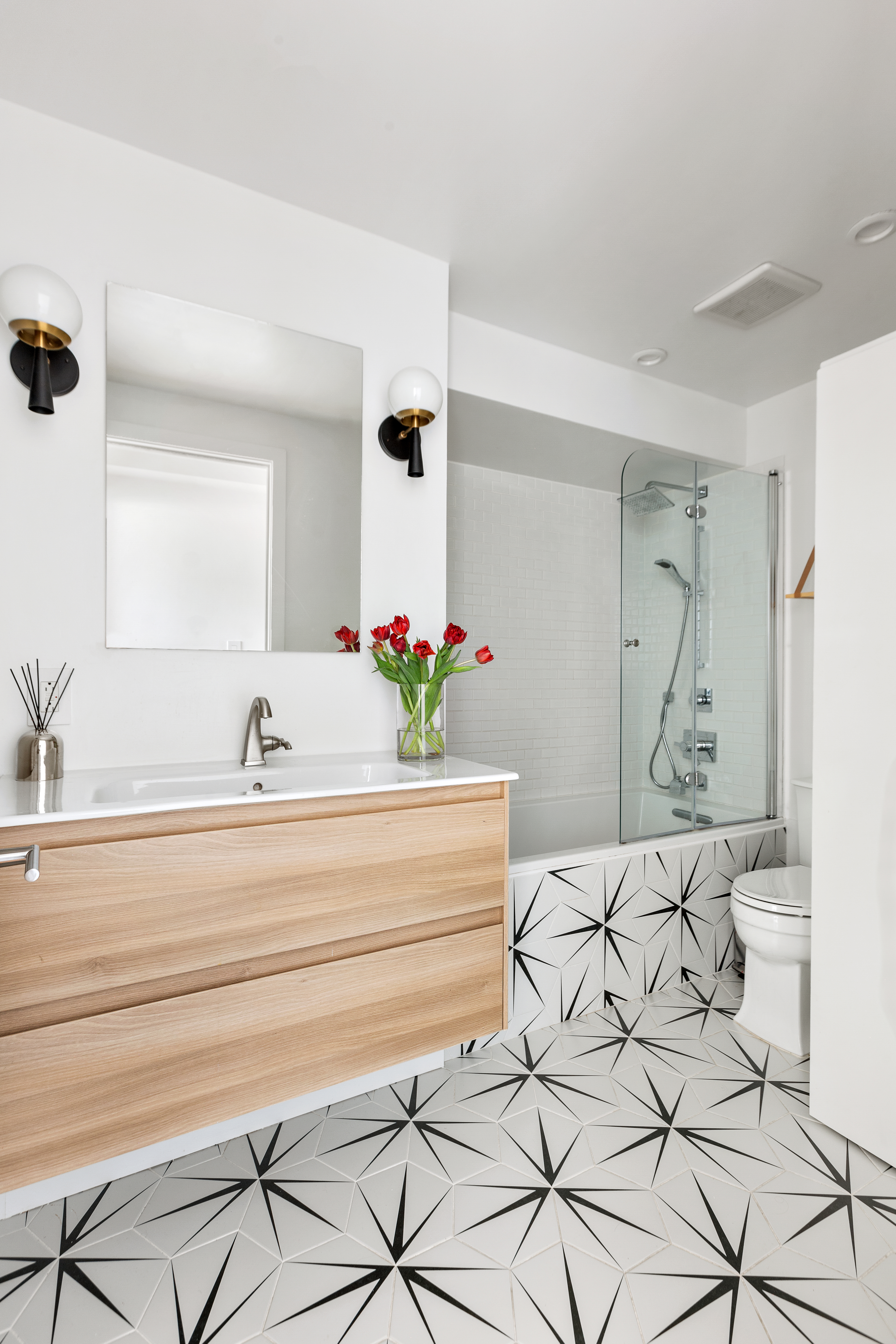 39 Madison Street, Unit 3B Brooklyn, NY 11238 - Photo 12 of 16 a bathroom with a sink and a mirror