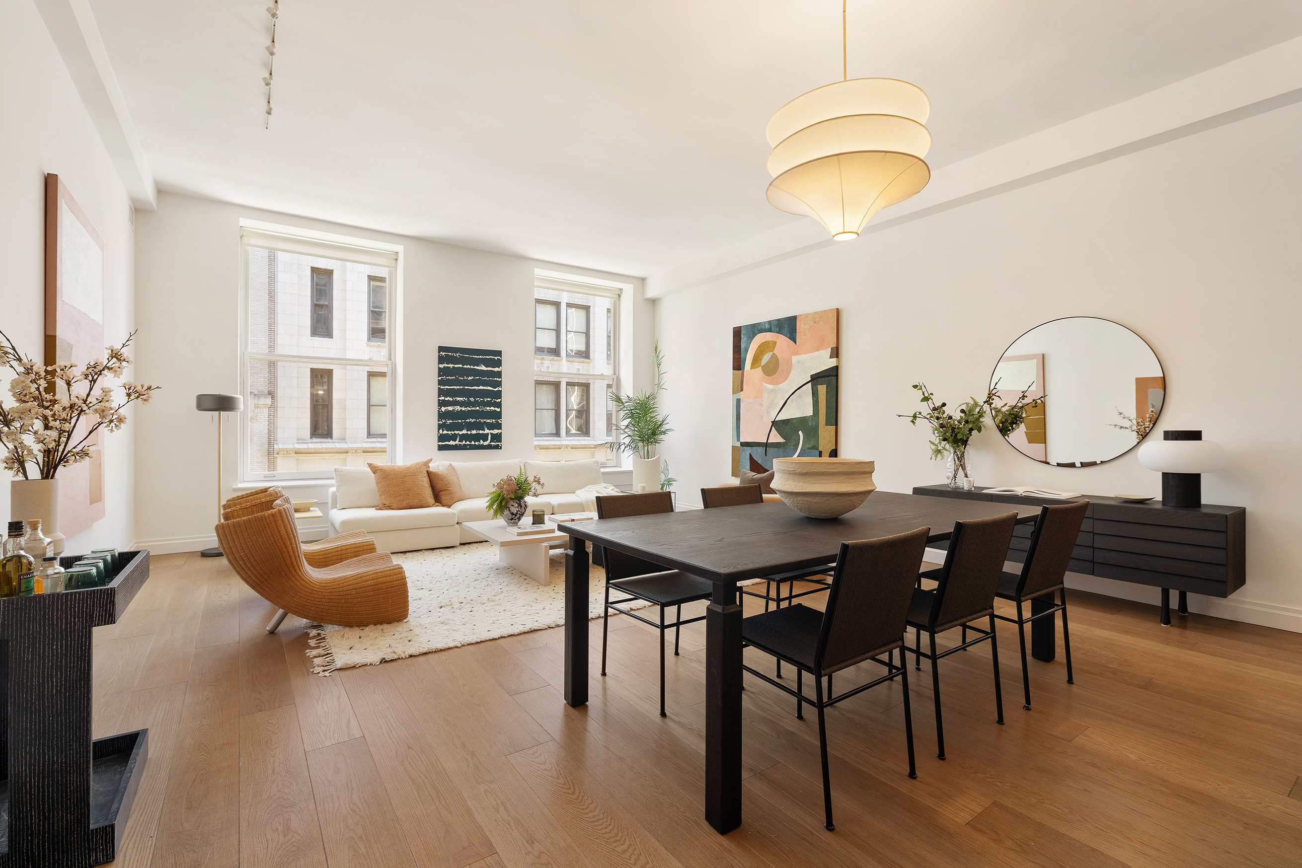 42 East 20th Street, Unit 4AD Manhattan, NY 10003 - Photo 1 of 19 a view of a dining room with furniture window and wooden floor