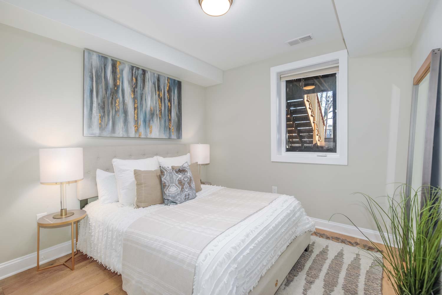 3123 Warder Street Northwest, Unit 1 Washington, DC 20010 - Photo 16 of 24 a bedroom with a bed and a lamp on table