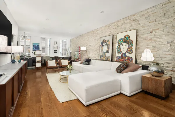 a living room with furniture and a table