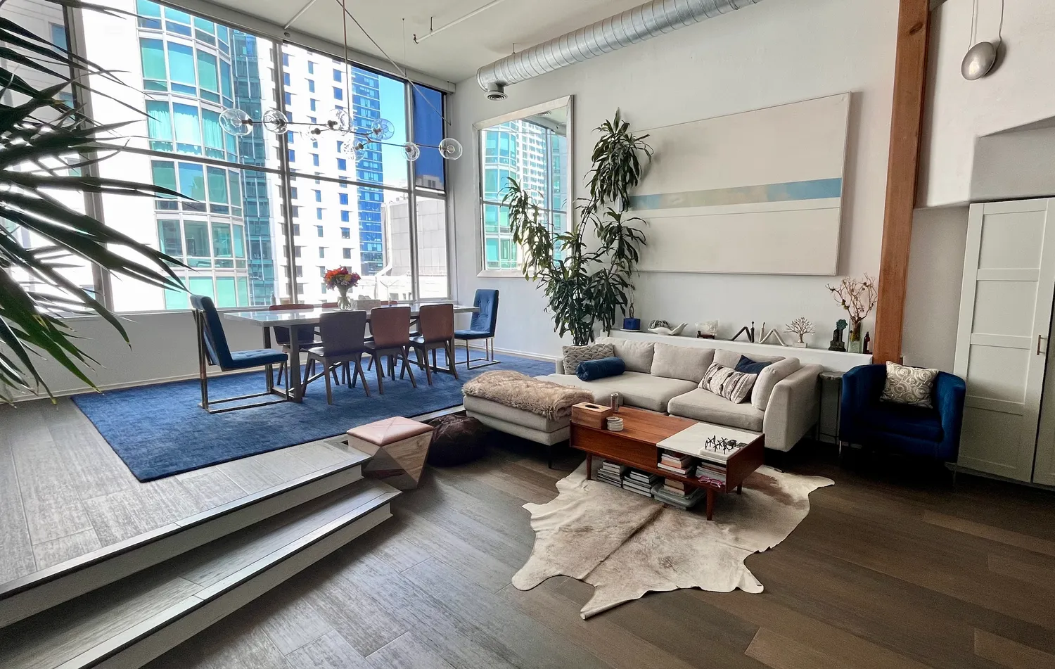 a living room with furniture or couch and a large window