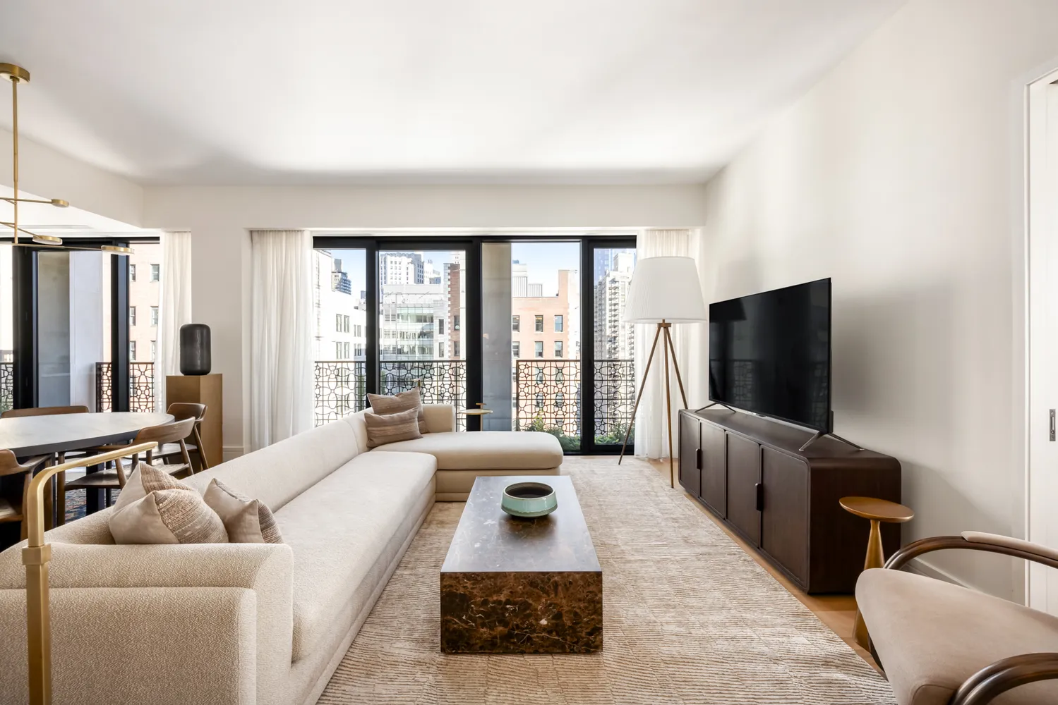 a living room with furniture and a flat screen tv
