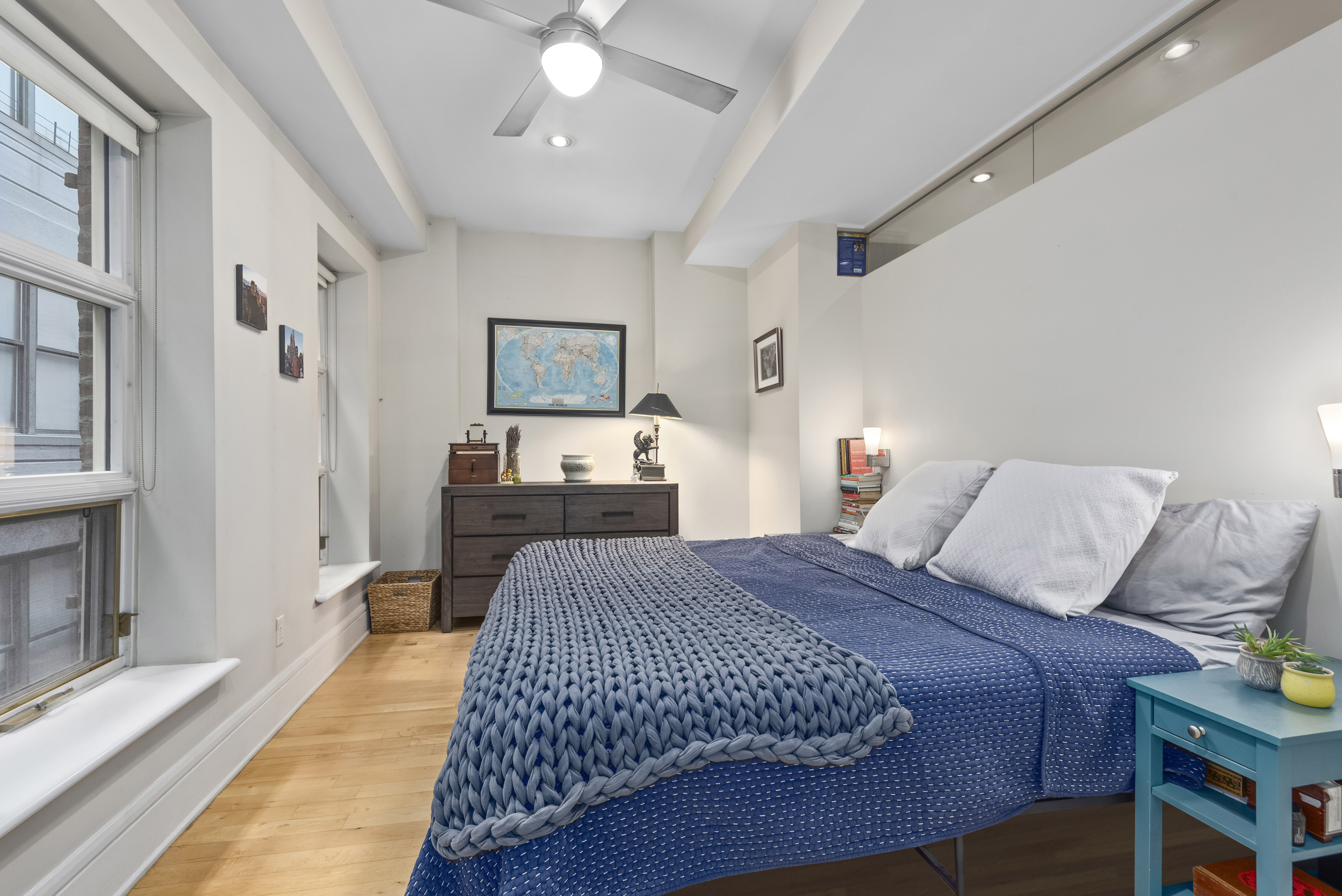 57 Front Street, Unit 305 Brooklyn, NY 11201 - Photo 7 of 10 a bedroom with a bed and a chandelier